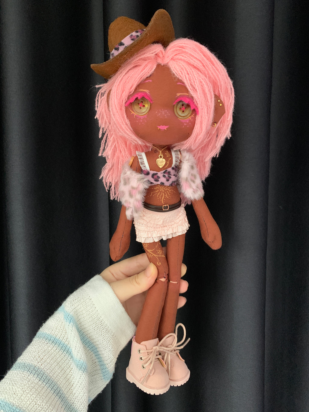 Full-length view of Coco Berry OOAK handmade cloth art doll with pink yarn hair, brown cowboy hat, button eyes, ruffled skirt, and pink boots.